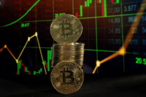 Bitcoin tokens and a price chart are seen in this illustration picture